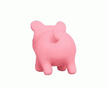 a pink pig is standing on its hind legs on a white background .