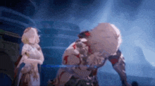 a man and a woman are standing next to each other in a dark room in a video game .