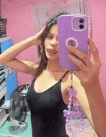 a girl is taking a selfie with her phone