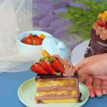 a slice of cake with strawberries on top on a plate