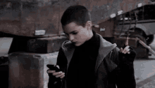 One Sec GIF - Dead Pool Texting On The Phone GIFs