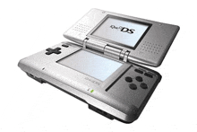 a silver nintendo ds is open and sitting on a table