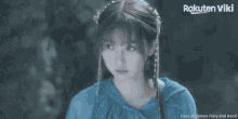 a rakuten viki advertisement with a girl in a blue coat