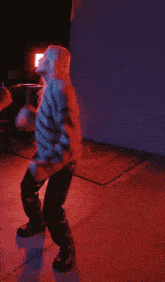 a blurry image of a person dancing in a dark room
