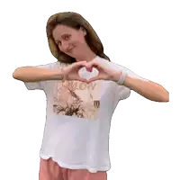 a woman wearing a white shirt that says follow me back