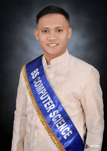 a man wearing a sash that says bs computer science on it