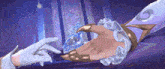 a person holding another person 's hand with the letter g on it