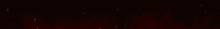 a red light is shining on a black background