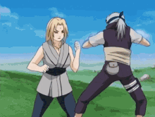 a man and a woman are standing in a field fighting