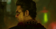 a painting of a man with sunglasses and the year 2005 on the bottom