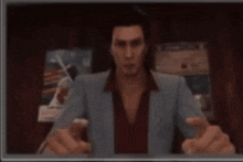 a blurry picture of a man in a blue suit and red shirt