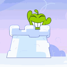 a cartoon character is standing on top of a snow castle and smiling
