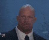 a bald man drinking a bud light can with a ring on his finger