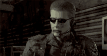 a man is wearing sunglasses and a headset while holding a bottle .