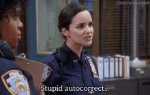 a police officer says stupid autocorrect next to another police officer