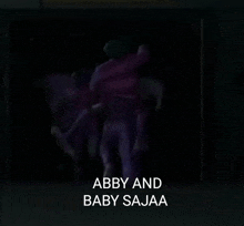 abby and baby sajaa is written on a black background