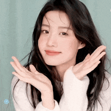 a woman making a funny face with her hands