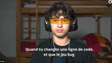 a man wearing headphones and sunglasses says " quand tu changes une ligne de code "
