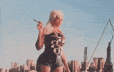 a woman blowing bubbles in front of a city skyline with a pyramid in the background