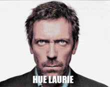 a close up of a man 's face with the words hue laurie below it