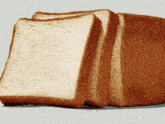 a loaf of bread has been cut into slices and is displayed on a gray background