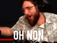 a man wearing headphones says oh non in white letters