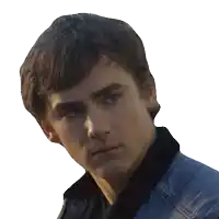 a close up of a man 's face with a denim jacket on