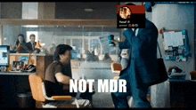 a man in a suit is standing next to a man in a chair with the words not mdr on the bottom