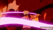 a person is holding a sword in their hand in a purple light .