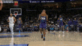 a basketball player with the name chr on his back is jumping in the air
