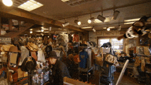 a man in a hat is looking at a texas shirt