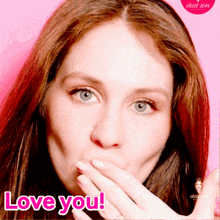 a woman covering her mouth with her hand and the words love you on the bottom right