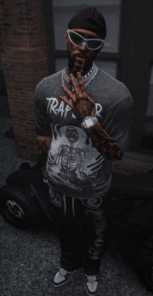 a man wearing sunglasses and a trap t-shirt is smoking a cigarette
