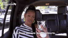 a woman sitting in the back seat of a car holding a cell phone with the words " it almost became inappropriate " above her