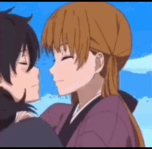 a boy and a girl are kissing each other in a cartoon .