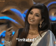 a woman with a necklace and earrings says irritated