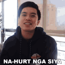 a young man wearing a black hoodie says na-hurt nga sya
