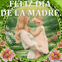 a picture of a woman holding a little girl with the words feliz dia de la madre on it