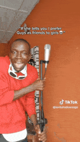 a man wearing sunglasses and a red shirt says " if she tells you i prefer guys as friends to girls " on the bottom