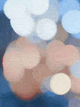 a blurred image of a bunch of circles with a blue background