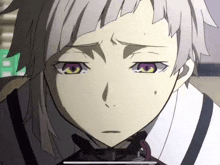 a close up of a person 's face with purple eyes and a white haircut .