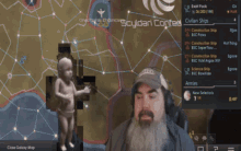 a man with a beard stands in front of a map that says scydan contec