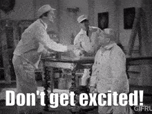 a black and white photo of two men shaking hands with the caption " don t get excited "