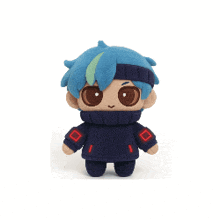 a stuffed toy with blue hair and red squares on its sleeves