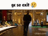 a video of a man riding a scooter with the words gc se exit written on the bottom