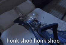 a skeleton laying on a bed with honk shoo written on the bottom