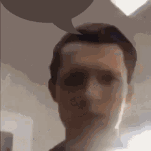 a man has a speech bubble above his head