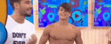 a shirtless man wearing a shirt that says do n't fix it