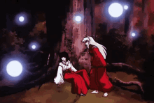 a man and a woman are standing next to each other in the dark