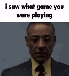 a man in a suit and tie with the words i saw what game you were playing above him